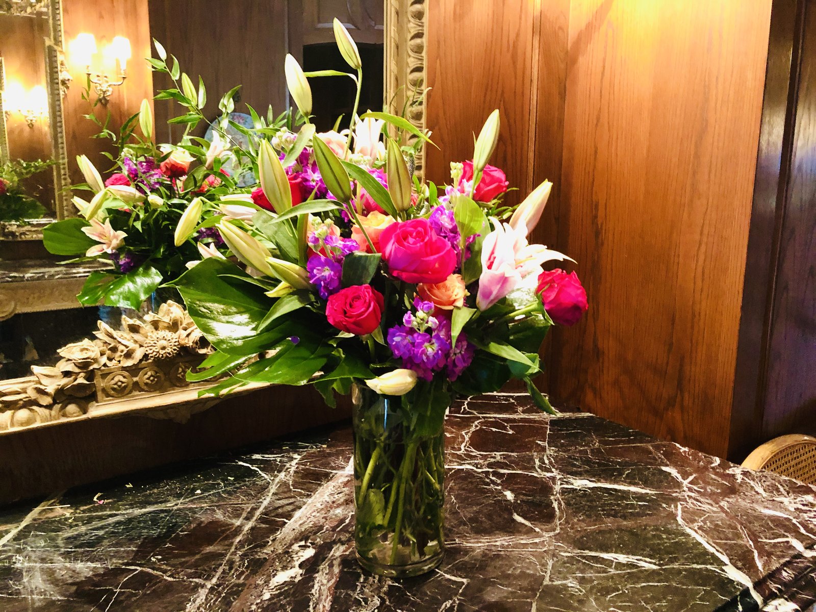 Bold lobby floral arrangement in fuchsia and green